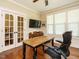 Cozy home office featuring hardwood floors, French doors, and ample natural light at 2317 Emerald Woods Dr, Wake Forest, NC 27587