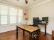 Bright home office with hardwood floors, wainscoting, and a large window at 2317 Emerald Woods Dr, Wake Forest, NC 27587