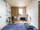Unfinished storage room with blue carpet and basic insulation materials in place at 2317 Emerald Woods Dr, Wake Forest, NC 27587