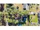 Aerial view of home surrounded by mature trees, highlighting property lines at 2418 Mont Haven Dr, Durham, NC 27712