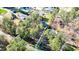 Aerial view of a lovely home surrounded by mature trees, offering privacy and a serene setting at 2418 Mont Haven Dr, Durham, NC 27712