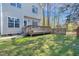 Exterior view of home with deck and partially fenced yard at 2418 Mont Haven Dr, Durham, NC 27712