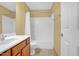 Bathroom with a single sink vanity and tub-shower combination, complete with neutral walls and fixtures at 2418 Mont Haven Dr, Durham, NC 27712