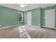Bright carpeted bedroom with natural light and a closet and ceiling fan at 2418 Mont Haven Dr, Durham, NC 27712