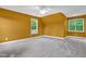 Spacious bedroom featuring neutral carpet, and light filled windows at 2418 Mont Haven Dr, Durham, NC 27712
