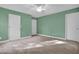 Spacious carpeted bedroom with large closets and light green walls at 2418 Mont Haven Dr, Durham, NC 27712