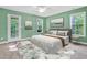 Cozy bedroom with French doors and natural light at 2418 Mont Haven Dr, Durham, NC 27712
