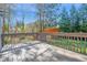 Outdoor deck with wood railing that overlooks private backyard, perfect for entertaining at 2418 Mont Haven Dr, Durham, NC 27712