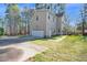 Exterior elevation view of home with large front driveway and attached garage at 2418 Mont Haven Dr, Durham, NC 27712
