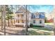 Charming two-story home featuring a welcoming porch, double balconies, and nicely landscaped front yard at 2418 Mont Haven Dr, Durham, NC 27712