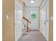 Bright foyer featuring neutral walls, staircase, and natural light, offering a welcoming entrance at 2418 Mont Haven Dr, Durham, NC 27712