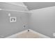 Functional laundry room with shelving, washing machine hookups and clean, neutral walls at 2418 Mont Haven Dr, Durham, NC 27712