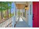 Inviting porch with classic white railings and wood ceiling, creating a cozy outdoor space at 2418 Mont Haven Dr, Durham, NC 27712