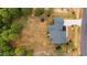 Aerial view of a home with a gray roof, surrounded by a well-maintained lawn and trees at 25 Leisure Ln # 2, Louisburg, NC 27549