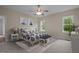 Comfortable bedroom featuring a ceiling fan, two windows, and a decorative accent bench at 25 Leisure Ln # 2, Louisburg, NC 27549