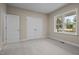 Serene bedroom with soft carpeting, a large closet, and a bright window for natural light at 25 Leisure Ln # 2, Louisburg, NC 27549