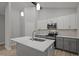 Modern kitchen with a large island, stainless steel appliances, and stylish pendant lighting at 25 Leisure Ln # 2, Louisburg, NC 27549