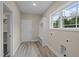 Mudroom with built in storage and a window for ample light at 25 Leisure Ln # 2, Louisburg, NC 27549
