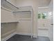 Walk-in closet with custom shelving and racks for maximizing storage and organization space at 25 Leisure Ln # 2, Louisburg, NC 27549