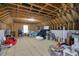 Unfinished attic space offers potential for expansion and creative design with exposed rafters and ample storage at 2709 Sardinia Ln, Apex, NC 27502