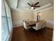 Traditional dining room featuring hardwood floors, a ceiling fan, and beige walls with bright trim at 2709 Sardinia Ln, Apex, NC 27502
