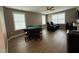 Game room with hardwood style floors, a poker table, and an entertainment center at 2709 Sardinia Ln, Apex, NC 27502
