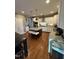 Spacious kitchen features granite countertops, stainless steel appliances, and an island with bench seating at 2709 Sardinia Ln, Apex, NC 27502