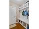 Functional mudroom equipped with built-in bench, storage cubbies, hooks, and convenient shelving at 2709 Sardinia Ln, Apex, NC 27502