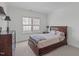 The bedroom features a ceiling fan, neutral walls, and plush carpet that offers a cozy retreat at 2832 Cameron Pond Dr, Cary, NC 27519
