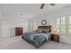 A comfortable bedroom showcases plantation shutters, neutral walls, and plush carpet that offers a cozy retreat at 2832 Cameron Pond Dr, Cary, NC 27519