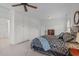 The bedroom boasts built-in cabinets, neutral carpet, and a ceiling fan for added comfort and convenience at 2832 Cameron Pond Dr, Cary, NC 27519