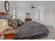 Spacious bedroom featuring a ceiling fan, white trim, and an elegant headboard with matching nightstands and dressers at 2832 Cameron Pond Dr, Cary, NC 27519