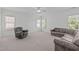 This spacious bonus room includes neutral walls, plush carpet, and a ceiling fan, perfect for various activities at 2832 Cameron Pond Dr, Cary, NC 27519