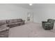 This spacious bonus room includes neutral walls, plush carpet, and a ceiling fan, perfect for various activities at 2832 Cameron Pond Dr, Cary, NC 27519