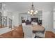 Elegant dining area with staircase and open view into the living room at 2832 Cameron Pond Dr, Cary, NC 27519