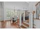 Open dining area with natural light and a view of the kitchen and staircase at 2832 Cameron Pond Dr, Cary, NC 27519