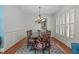 Elegant dining room with hardwood floors, a large table, and traditional decor at 2832 Cameron Pond Dr, Cary, NC 27519