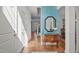 Elegant foyer with beautiful wooden floors and staircase leading to the upper level at 2832 Cameron Pond Dr, Cary, NC 27519