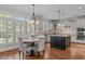 Spacious eat-in kitchen with granite counters and hardwood floors at 2832 Cameron Pond Dr, Cary, NC 27519