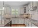 Bright kitchen with granite countertops, tiled backsplash, and lots of cabinet space at 2832 Cameron Pond Dr, Cary, NC 27519