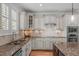 Well-appointed kitchen with custom cabinetry, granite countertops, and a stainless steel sink at 2832 Cameron Pond Dr, Cary, NC 27519