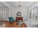 Sophisticated living room featuring hardwood floors, classic furnishings, and natural light at 2832 Cameron Pond Dr, Cary, NC 27519