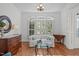 Bright living room featuring hardwood floors and large windows with beautiful natural light at 2832 Cameron Pond Dr, Cary, NC 27519