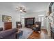 Spacious living room showcases hardwood floors and a cozy seating area with a fireplace at 2832 Cameron Pond Dr, Cary, NC 27519