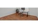 Minimalist office space with hardwood floors, desk, and chair at 2832 Cameron Pond Dr, Cary, NC 27519