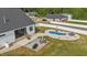 This expansive yard includes a patio with seating, lush lawn, and a kidney-shaped in-ground pool for summer fun at 30 Devilwood Dr, Four Oaks, NC 27524