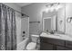 This is a bathroom with a granite countertop, a shower, and a toilet at 30 Devilwood Dr, Four Oaks, NC 27524