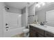 This is a bathroom with granite countertops, a shower, and a toilet at 30 Devilwood Dr, Four Oaks, NC 27524