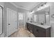 Elegant bathroom with dual sinks, granite countertops, tile floors, and neutral colors at 30 Devilwood Dr, Four Oaks, NC 27524