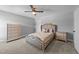 Bedroom with an upholstered bed, dresser, carpet flooring, and ceiling fan at 30 Devilwood Dr, Four Oaks, NC 27524